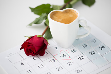 Image showing close up of calendar, heart, coffee and red rose