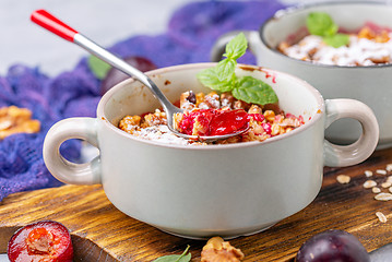 Image showing Red cherry plum crumble for breakfast.