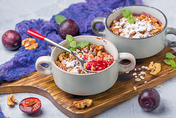 Image showing Red cherry plum crumble with walnut crumb.