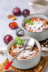 Image showing Delicious crumble of red cherry plum and oatmeal.