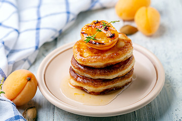 Image showing Fritters with apricot jam and thyme for breakfast.