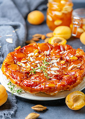 Image showing Homemade tarte tatin pie with apricots and thyme.