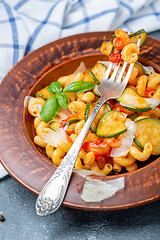 Image showing Italian pasta cavatappi with zucchini and tomatoes.