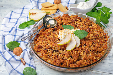 Image showing Crumble with pear, cinnamon and walnuts.