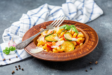 Image showing Cavatappi pasta with zucchini and tomatoes.