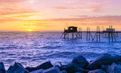 Image showing Huts of fishermen in the sunset