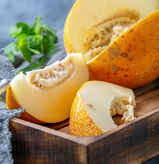 Image showing Slices of ripe yellow melon close up.