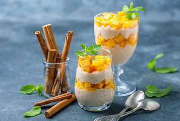 Image showing Rice pudding with peach slices for breakfast.