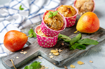 Image showing Homemade muffins with pear and granola.