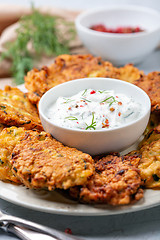 Image showing Zucchini fritters with spicy yogurt sauce.