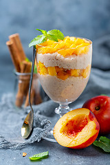 Image showing Rice pudding with peach slices and spices.