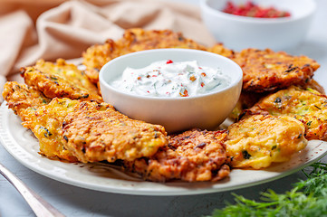 Image showing Zucchini pancakes with yogurt sauce.