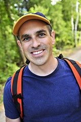 Image showing Man hiking on forest trail