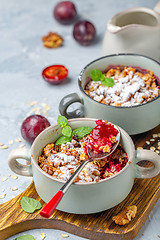 Image showing Delicious crumble of red cherry plum and oatmeal.