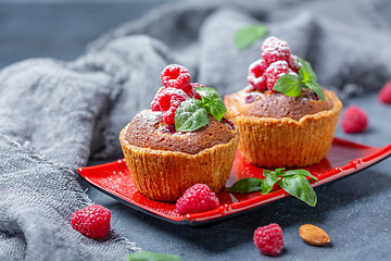 Image showing Tartlets with red raspberries and frangipani.