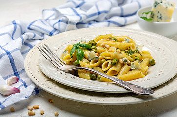 Image showing Delicious pasta with green peas and blue cheese.