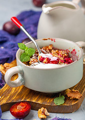Image showing Red cherry plum crumble for healthy breakfast.