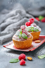 Image showing Raspberry tartlets with almond cream.