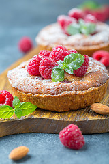 Image showing Delicious mini-tarts (tartlets) with raspberries.