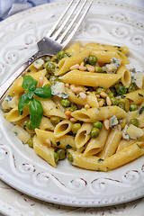 Image showing Penne pasta with green peas.