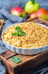 Image showing  Apple crumble in white ceramic baking form.