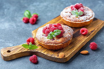 Image showing Delicious raspberry mini tarts (tartlets).