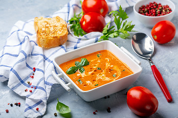 Image showing Tomato soup with green basil.