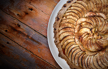 Image showing Traditional french apple tart over brown planks