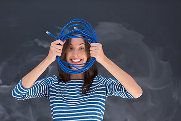 Image showing woman holding a internet cable in front of chalk drawing board