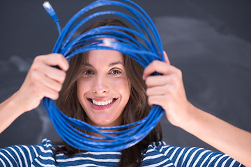 Image showing woman holding a internet cable in front of chalk drawing board