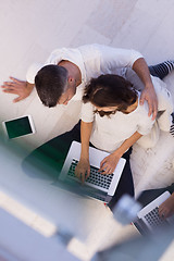 Image showing couple using tablet and laptop computers top view