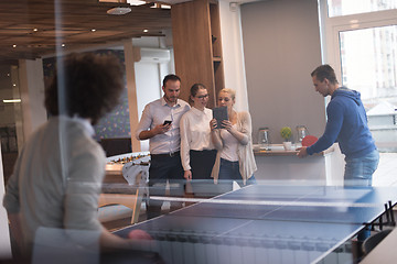 Image showing startup business team playing ping pong tennis