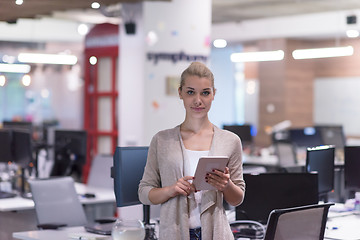 Image showing Business Woman Using Digital Tablet in front of startup Office