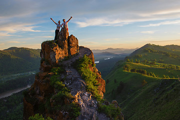 Image showing Happy man and woman on top mountain