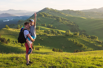 Image showing Happy father and son in the Altai mountains