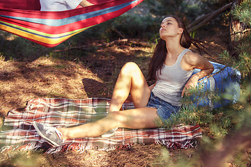 Image showing Party, camping of men and women group at forest. They relaxing and eating barbecue