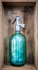 Image showing vintage turquoise soda glass bottle