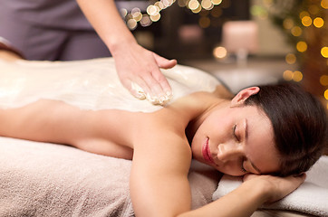 Image showing woman lying and having back massage at spa