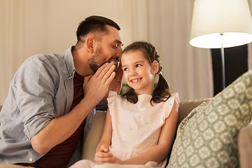 Image showing happy father whispering secret to daughter at home