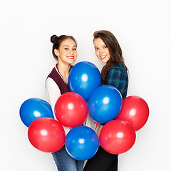 Image showing happy teenage girls with helium balloons