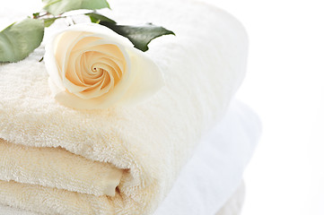 Image showing Stack of towels and rose