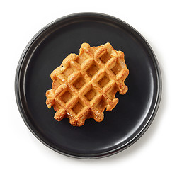 Image showing freshly baked belgian waffle on black plate