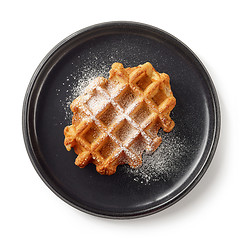 Image showing freshly baked belgian waffle on black plate