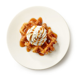 Image showing belgian waffle decorated with cream and caramel sauce