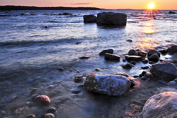 Image showing Sunset over water