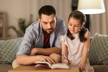 Image showing father and daughter doing homework together