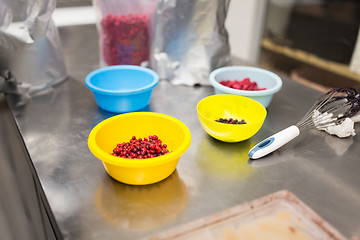 Image showing berries in bowls at confectionery shop kitchen