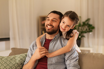 Image showing happy father and little daughter hugging at home