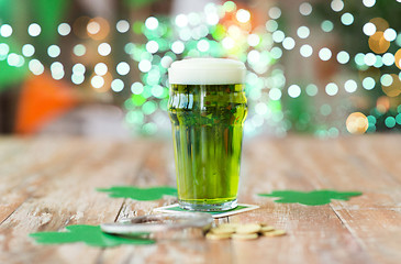 Image showing glass of green beer, horseshoe and golden coins