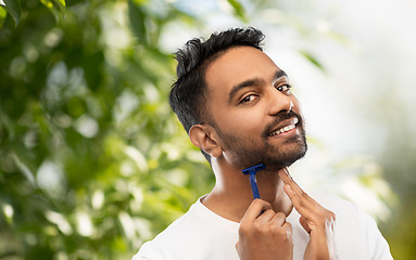 Image showing indian man shaving beard with razor blade